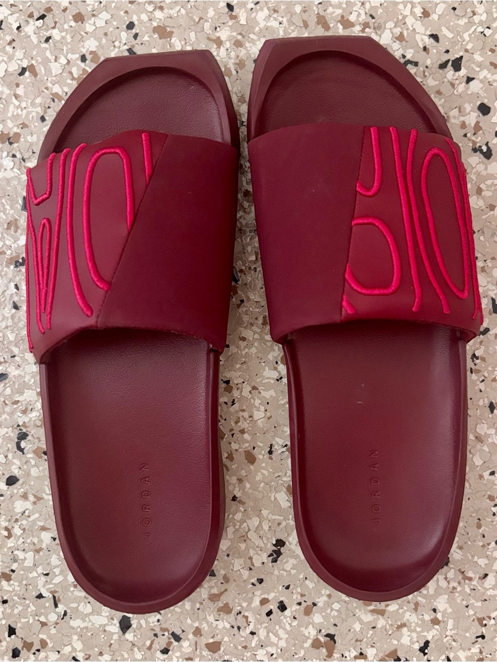 Nike Jordan Women's Burgundy Slide Sandals with Raised Stitching